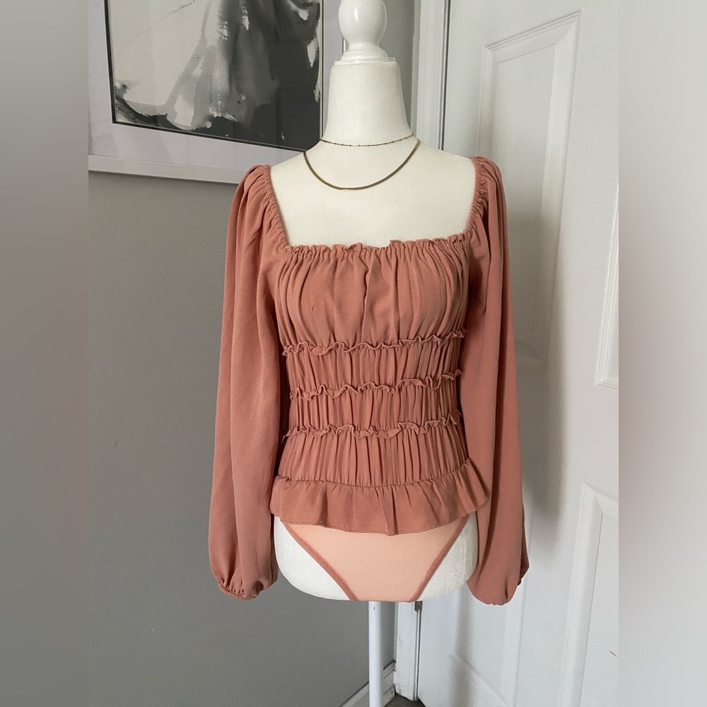 Ruffled blush color top